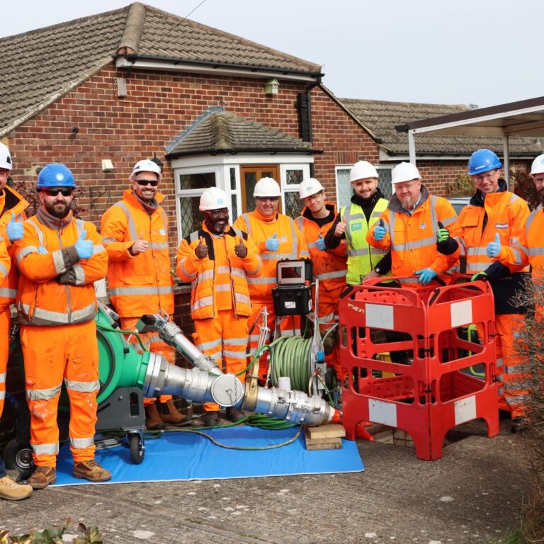 workmen giving a thumbs up, standing with Brawo Magnavity LED curing system